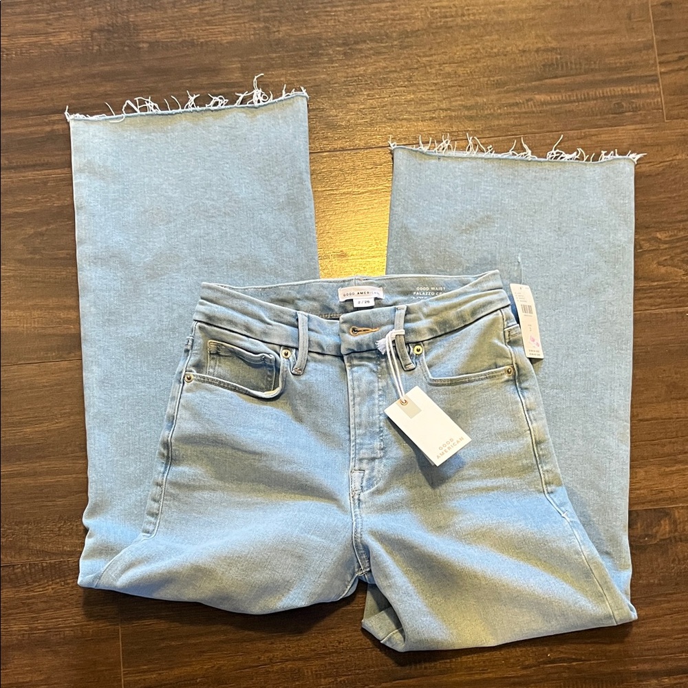 Good American Light Blue Flare Jeans with Frayed Hem